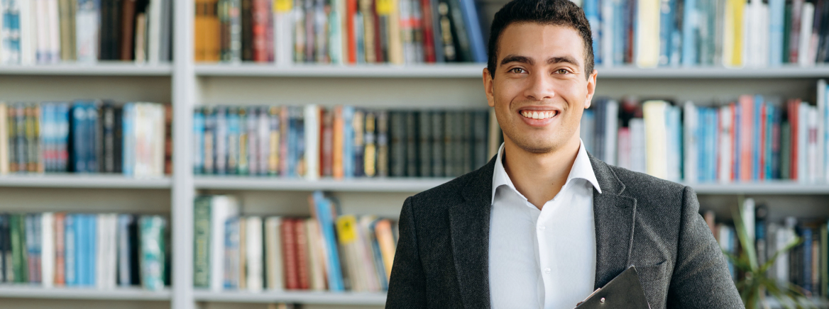 Portrait of handsome successful hispanic man dressed in formal stylish suit and looking directly at the camera. Confident business mentor, manager or entrepreneur