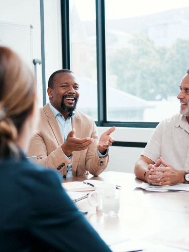 Shot of a group of businesspeople listening to a colleagues ideas during a meeting.