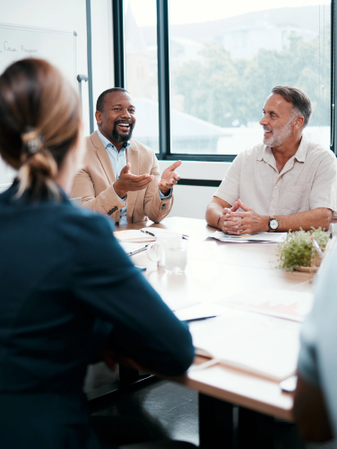 Shot of a group of businesspeople listening to a colleagues ideas during a meeting.
