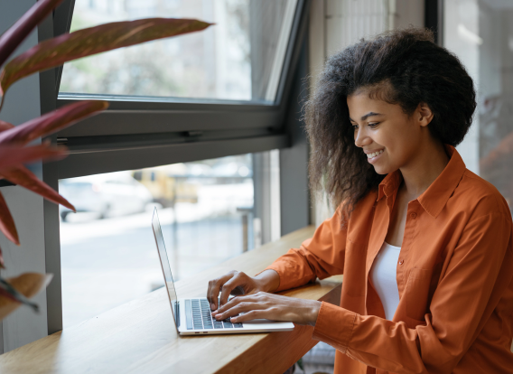 Header Image PI Public Record Request Photo of a woman using her laptop computer.